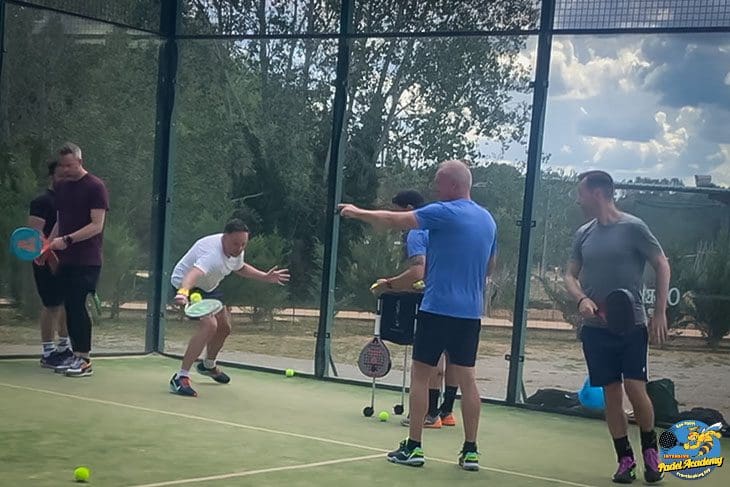 Paul van Oostveen, Captain Padel Coach in action in Oller del Mas, for Eventbooking.top and bee-padel.com from, Spain, Black Crown, Apache, Mimón business retreats, off the wall behind the ball action