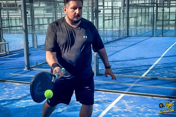 Witness the skillful forehand volley action of an Italian Padel player in the Padel Clinic, Barcelona, Spain, using Head and Under Armour gear.