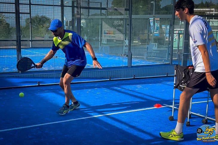 Padel trainer Xavi Llarden, training Suriname padel player to stand sideways while hitting a forehand, during the Padel Clinic, Academy, Maresme, Catalunya, Barcelona