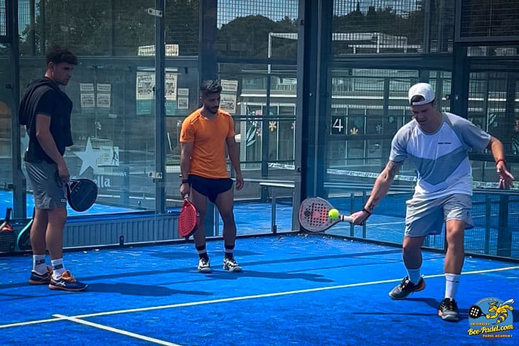 Sergi Rodriguez Fernandez explaining drive to players from Saudi Arabia during the Intensive Padel Clinic of eventbooking.top and bee-padel.com in, Barcelona, Black Crown, Asics Worlds best Padel coaches