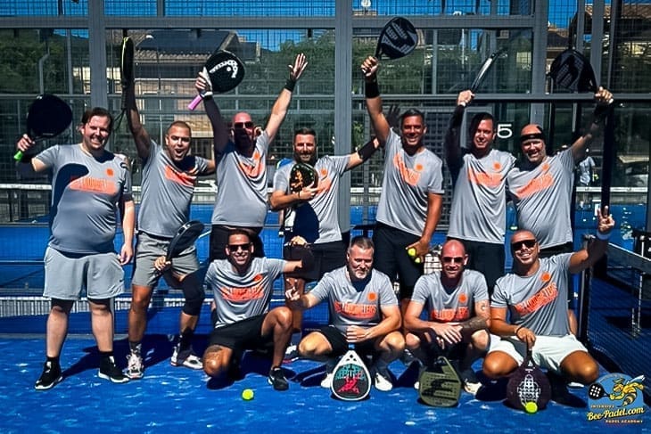 Advanced and intermediate group of happy padel players