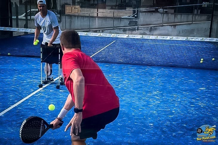 expert level intensive padel session of the wall back hand