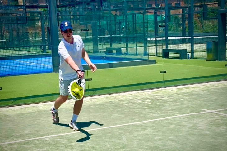 Player practicing a drop shot during defensive padel training at Masnou Padel Ocata, part of Eventbooking.top’s camps for adults and juniors