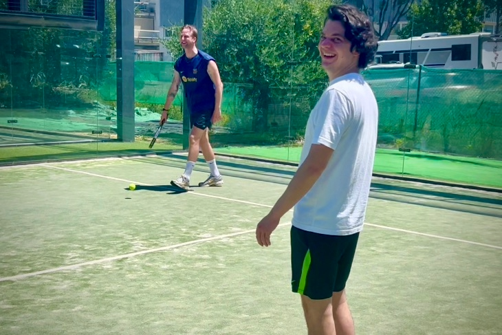 Players sharing a fun moment during defensive shot training at Eventbooking.top padel sessions, at one of the best places to play padel