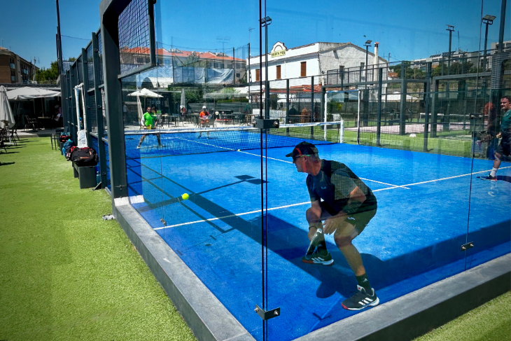 Player practicing a wall shot on the centre court at Masnou Padel Ocata during an Eventbooking.top padel camp, one of the best places to play padel in Spain