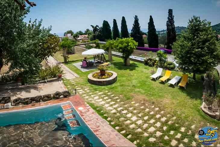 Garden view room at Masia Can Casadellà with pool, mountains, and sea nearby, close to EventBooking.top padel courts and local restaurants