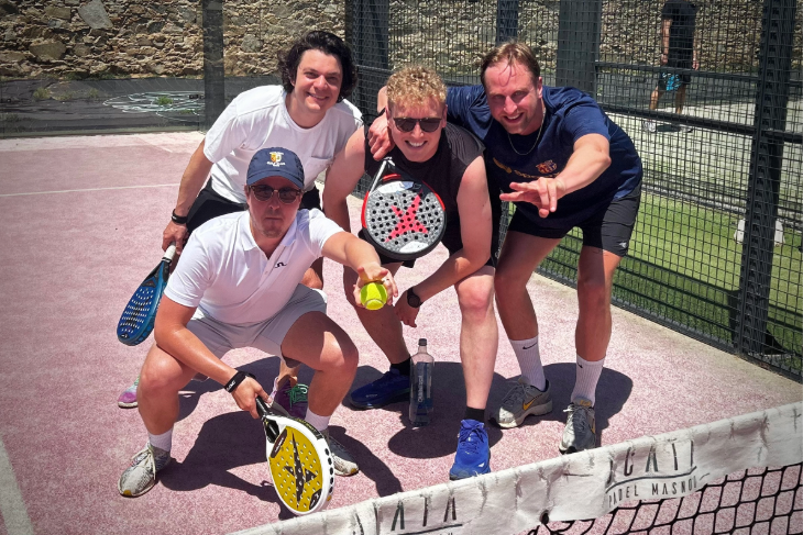 Happy Dutch padel players enjoying a match on the singles court at Masnou Padel Ocata, Barcelona, Spain, near the beach