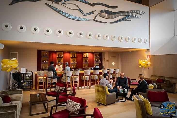 Indoor Bar at Hotel Atenea Port Mataró | Air-Conditioned Social Lounge by Eventbooking.top Air-conditioned indoor bar at Hotel Atenea Port Mataró — a cozy social spot to relax and meet new friends