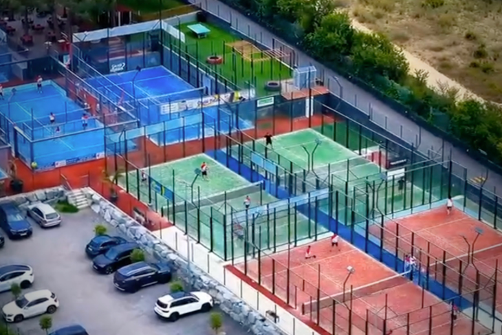 Aerial view of Can Teixidó Padel Club in the Maresme area of Barcelona, featuring multiple panoramic padel courts in a sunny Mediterranean setting.