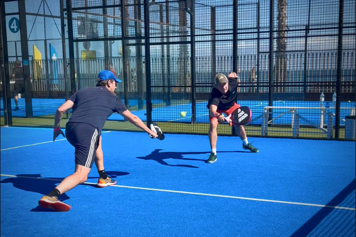 Eventbooking.top padel clinic participants at Barceloneta, focusing on communication, teamwork, and technique