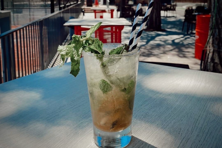Players enjoying refreshing long drinks on the terrace at Can Teixidó Padel Club after training and weekly tournaments.