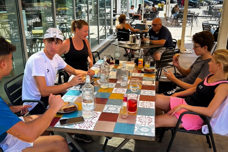 Padel players and trainers enjoying a relaxing break at Sorli restaurant during an intensive padel clinic near Barcelona