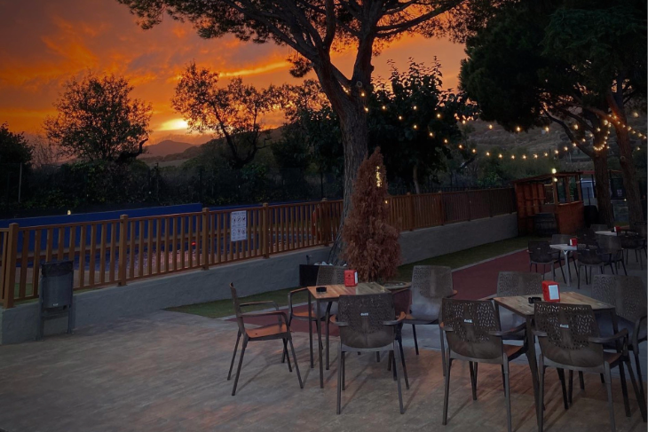Romantic sunset view from the terrace of Can Teixidó restaurant overlooking the Maresme coastline.